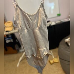 tan and black tank top body suits